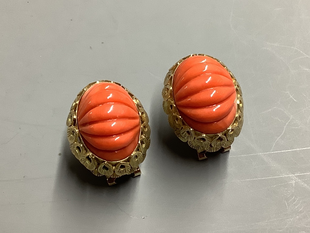 A pair of carved coral oval earrings,